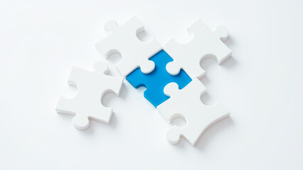 Obraz premium White Puzzle Pieces with One Blue Piece as Unique Element on White Background