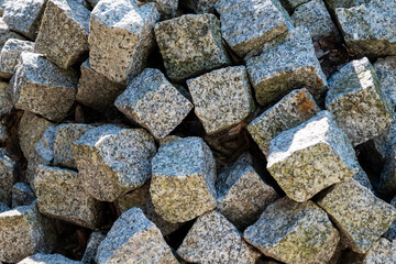 pile of grey paving stones or cobblestones - textured background