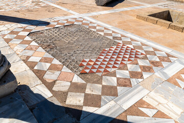 Ancient marble tiled floor at at Caesarea National Park in Caesarea, Israel.

