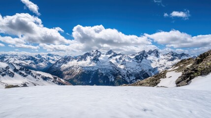 Panoramic view of snow-capped mountains under a vibrant blue sky with fluffy clouds, showcasing a pristine snowy foreground. : Generative AI