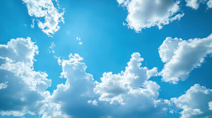 Bright, sunny day with fluffy cumulus clouds scattered across a vibrant blue sky, creating a serene and peaceful atmosphere. : Generative AI