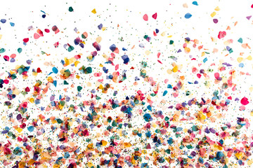 Fototapeta premium Colorful confetti scattered across a white background, symbolizing celebration and joy