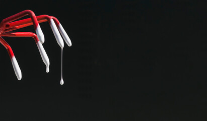 Dripping paint on a dark background