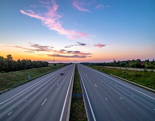 Serene Sunset Over Empty Highway with Colorful Sky and Green Nature