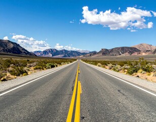 Fototapeta premium Long Straight Road Through Scenic Landscape Under Blue Sky