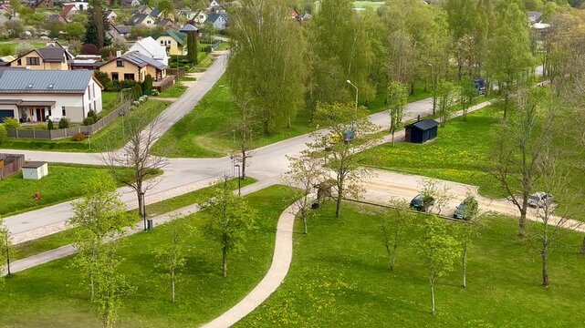 Parking area and quiet residential streets next to Kuldīga observation tower in spring