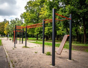 Obraz premium Outdoor Fitness Equipment in Urban Park Surrounded by Greenery