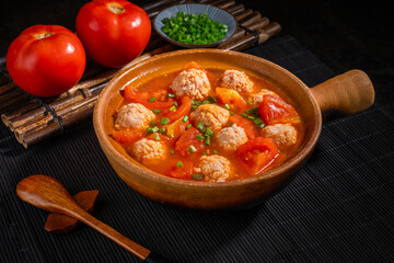 Tomato pork soup, red soup base and shallots as seasoning, traditional Chinese food