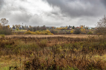 autumn landscape with fog and clouds