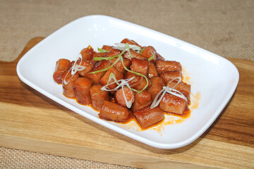 Delicious dish of stir-fried sausage. restaurant cuisine stir-fried sausage