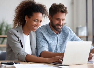 Obraz premium young man and woman using laptop