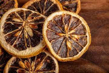 Dried lemon slices under macro lens, white background