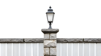 Stone pillar fence post with classic lantern style light fixture mounted on top, ultra HD photo, isolated on transparent  background