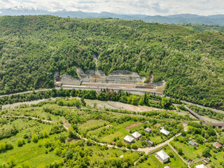 Aerial view of a quiet highway passing through a tunnels in a picturesque hilly region Rikoti Pass