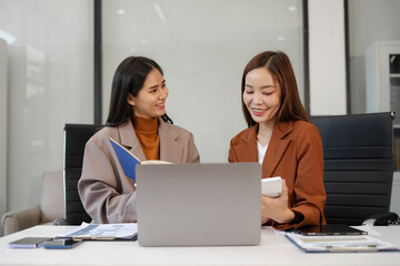 Fototapeta premium Businesswomen team or financial data analysts working, Plan to analyzing projects in the office.