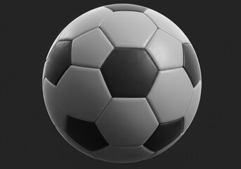 Fototapeta premium Close-up of a soccer ball with black and white panels against a dark gray background in a studio shot