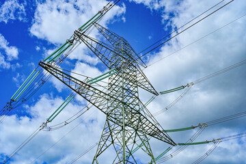 Power poles in spring on the field and meadow, Brandenburg, Germany