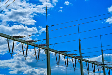 Power poles in spring on the field and meadow, Brandenburg, Germany