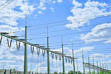 Power poles in spring on the field and meadow, Brandenburg, Germany