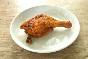 crispy fried chicken tight and leg fermenting with herb on plate 