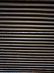 Obraz premium Dark metal shutter forming a textured background in prague