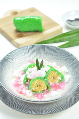 Green banana ice covered in a pandan leaf flour.