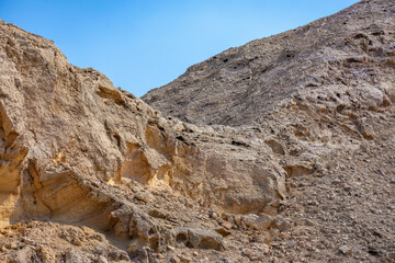 Natural rocky formation in Sharjah, UAE. Visible erosion layers reveal geological history shaped over millions of years.