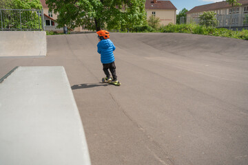 Child Skating in Park with Protective Gear