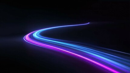 Abstract light trails blue and purple on black background creating a sense of motion.