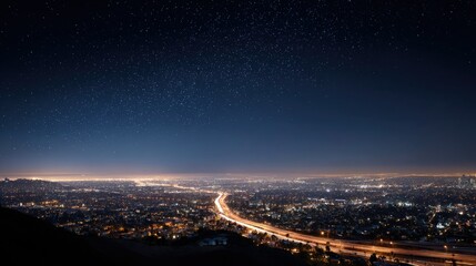 Obraz premium Nighttime aerial view of a metropolitan city, with endless rows of streetlights and brightly lit roads, showing the city in full motion under the stars