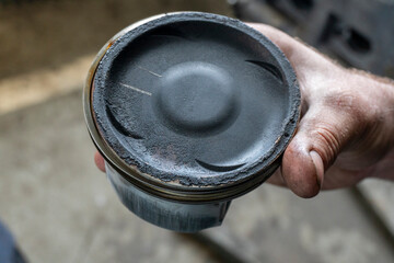 Car service. Engine pistons in worn condition. Car repair concept. Car maintenance