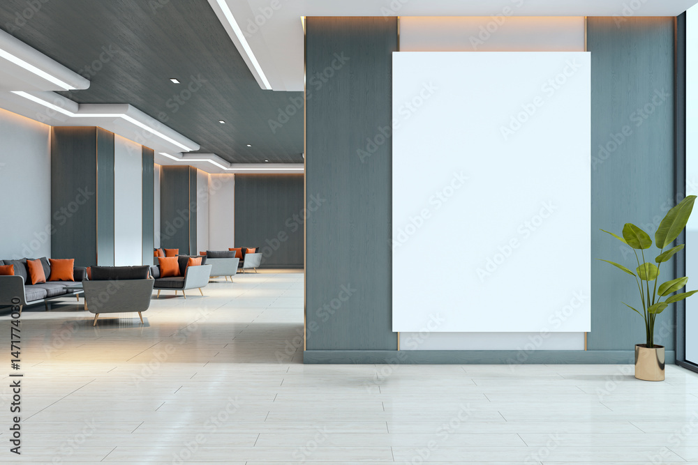 Poster blank vertical poster mockup on large wall in modern lobby with seating area and potted plant, clean