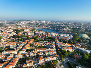 Fototapeta premium Elevated view of Porto, Portugal with riverfront, rooftops, and iconic Douro River