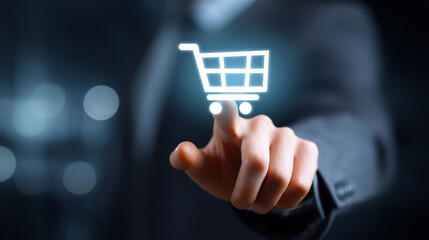 Hand of a Businessman Touching a Digital Shopping Cart Icon on a Dark Background to Represent Online Shopping Concepts and E-commerce Trends