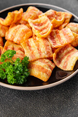 Chips bacon crispy rashers corn snacks fast food natural food fresh dish on the table rustic food top view copy space