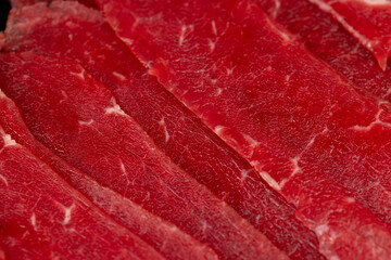 beef jerky without cooking, beef dishes cut into thin slices and eaten raw, close up