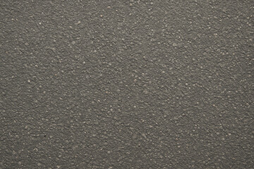 Obraz premium A close-up view of a textured surface showcasing an intricate pattern resembling grains and specks. This versatile image can be used for various design projects and backgrounds.