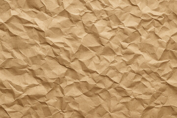 Obraz premium A close-up view of crumpled brown paper, showcasing its textured surface