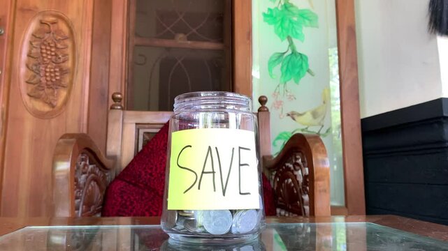 Saving Money in a Glass Jar: A Simple Act of Financial Prudence and Future Planning