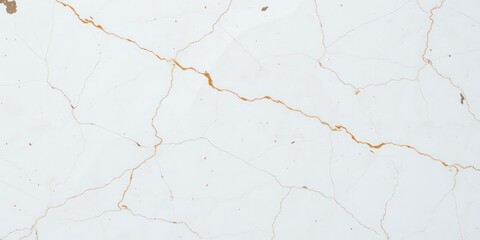 Fototapeta premium High-resolution image depicting a light-colored surface with a network of fine cracks, some exhibiting a gilded appearance.
