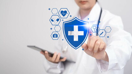 A healthcare professional interacts with digital health icons, symbolizing modern medical technology and patient care.