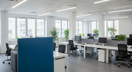 Fototapeta premium Modern Office Space: Bright, Clean Workspace with Desks, Plants & Natural Light - Ideal for Productivity & Collaboration