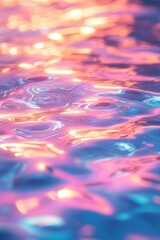 Abstract Water Surface with Pink and Blue Reflections Creates a Textured Fluid Dynamic Background with Vibrant Iridescent Tones