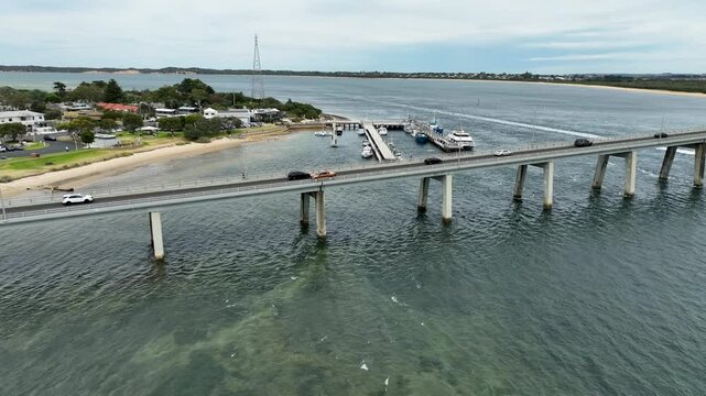 Cars travelling through the San Remo Bridge in Phillip Island, Victoria Australia