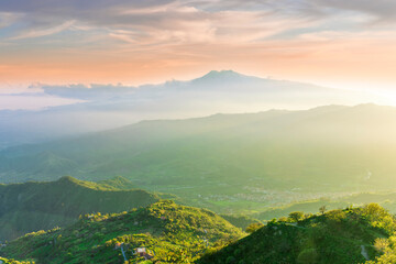 highland mountain landscape of beautiful sunset or sunrise with nice mountain peaks and slopes,...