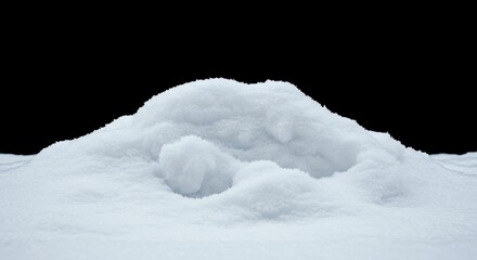 Pile of white snow against a black background