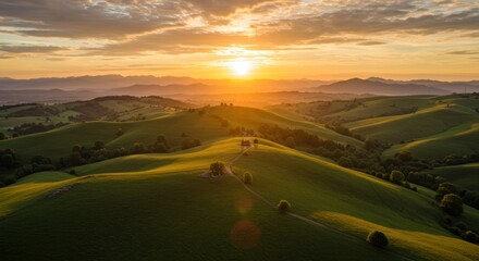 Sunset over rolling green hills