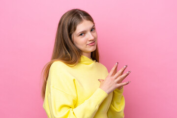 Teenager Russian girl isolated on pink background scheming something