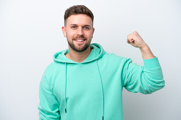 Young caucasian man isolated on white background doing strong gesture