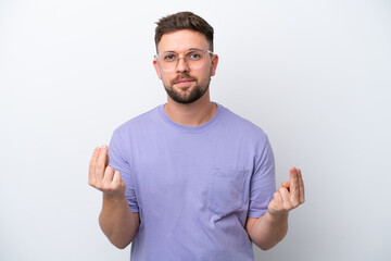 Fototapeta premium Young caucasian man isolated on white background making money gesture